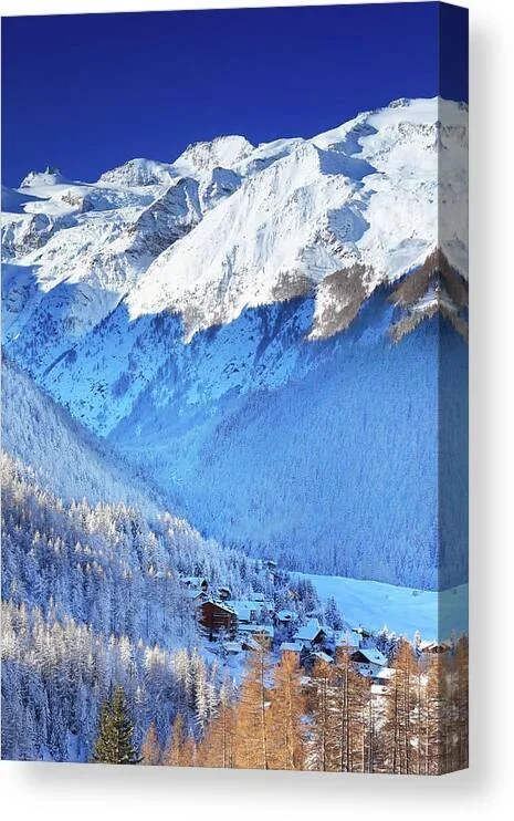 Italy, Aosta Valley, Aosta District, Alps, Val Di Cogne, Cogne, The Village Of Cogne And The Gran Paradiso Group In Background After A Winter Snowfall Canvas Print